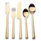 Set of gold-plated cutlery including a fork, knife, and two spoons on a white background.