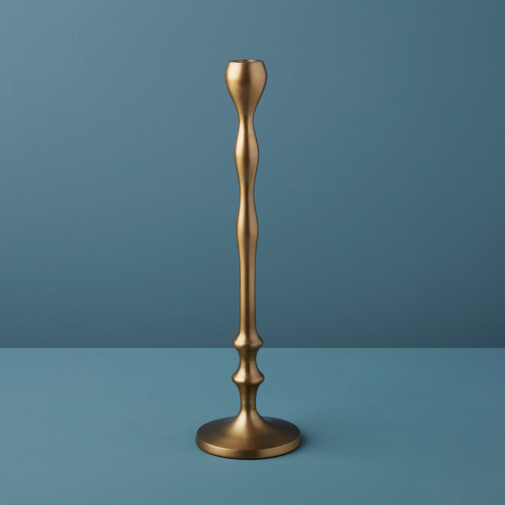 Gold candlestick on a blue background