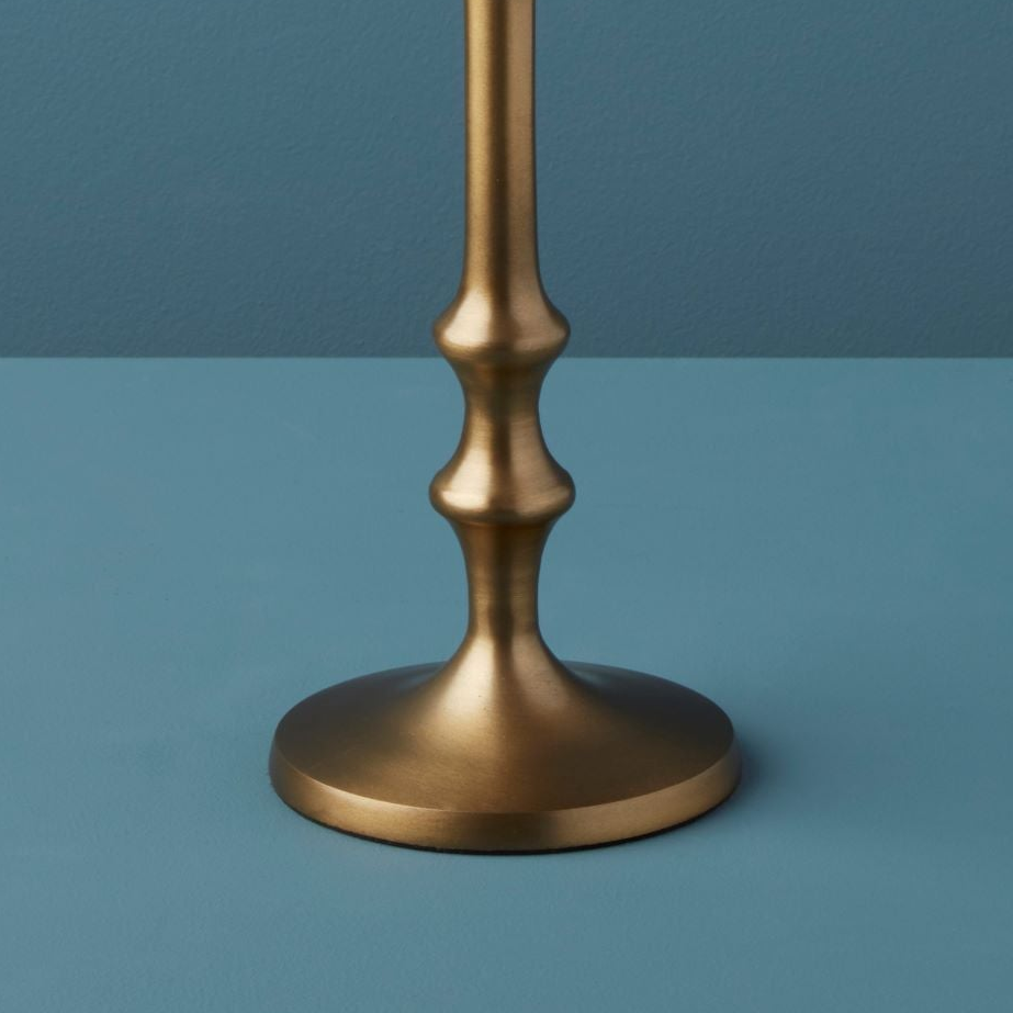 Bronze candlestick on a blue background