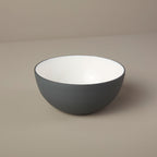 Gray bowl on a beige background