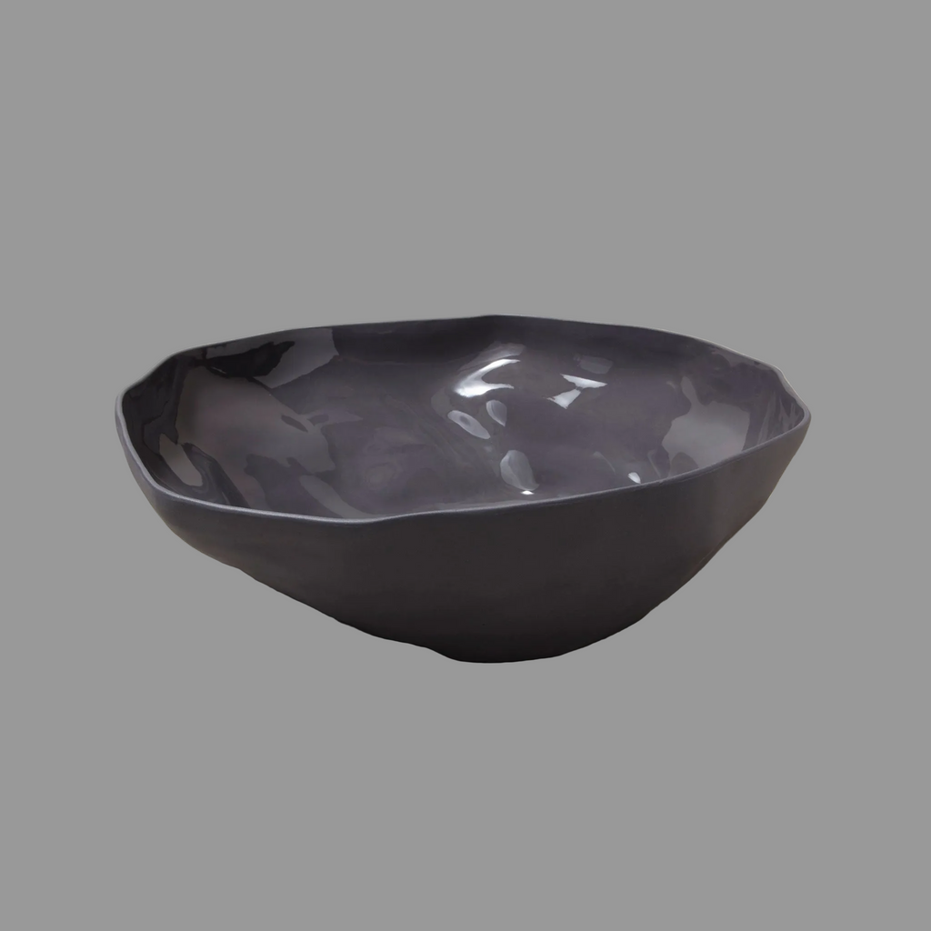 Black ceramic bowl on a gray background