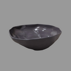 Black ceramic bowl on a gray background