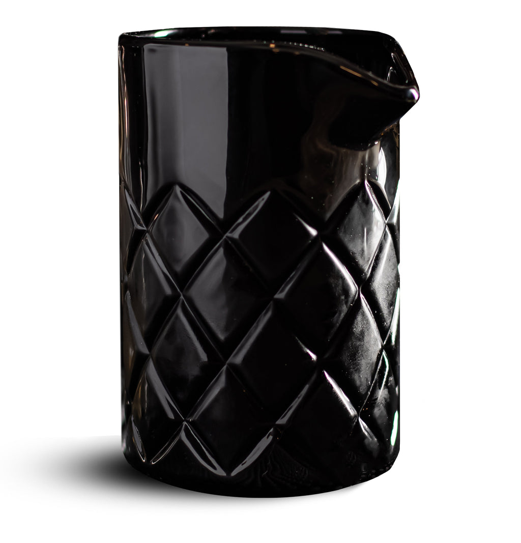 Black textured glass mixer on a white background