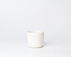 White ceramic mug on a white background