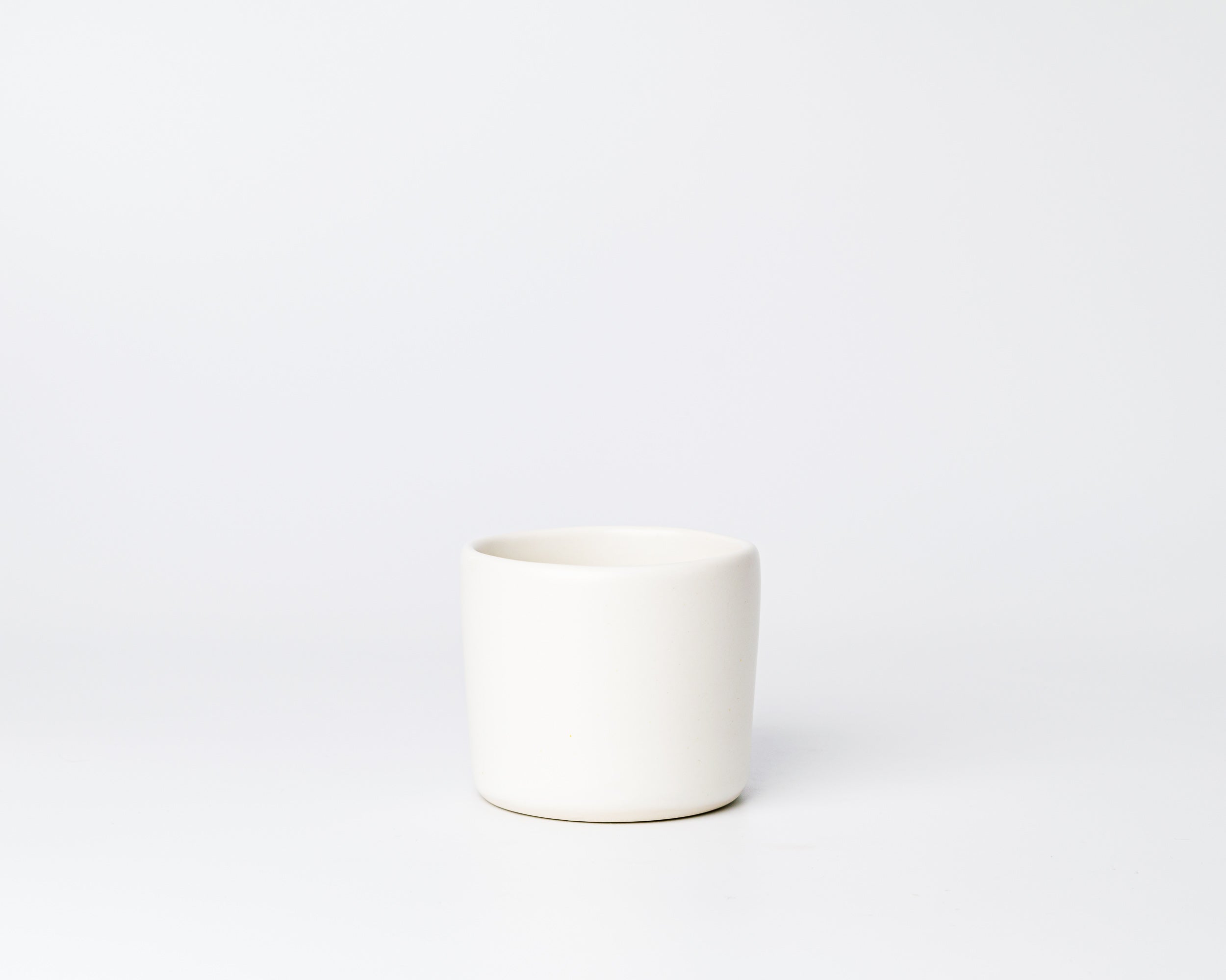 White ceramic mug on a white background