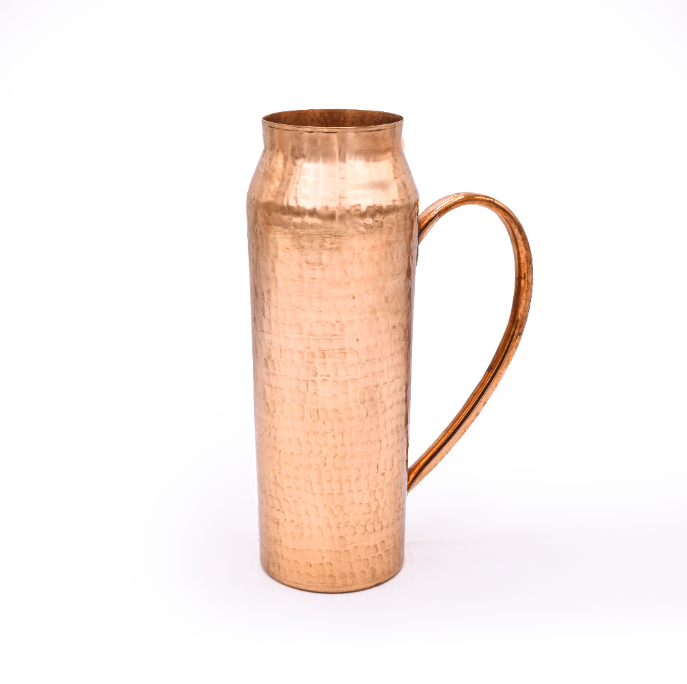 Copper pitcher with a handle on a white background