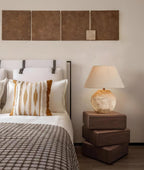 Bedroom with bed, lamp, and wall art