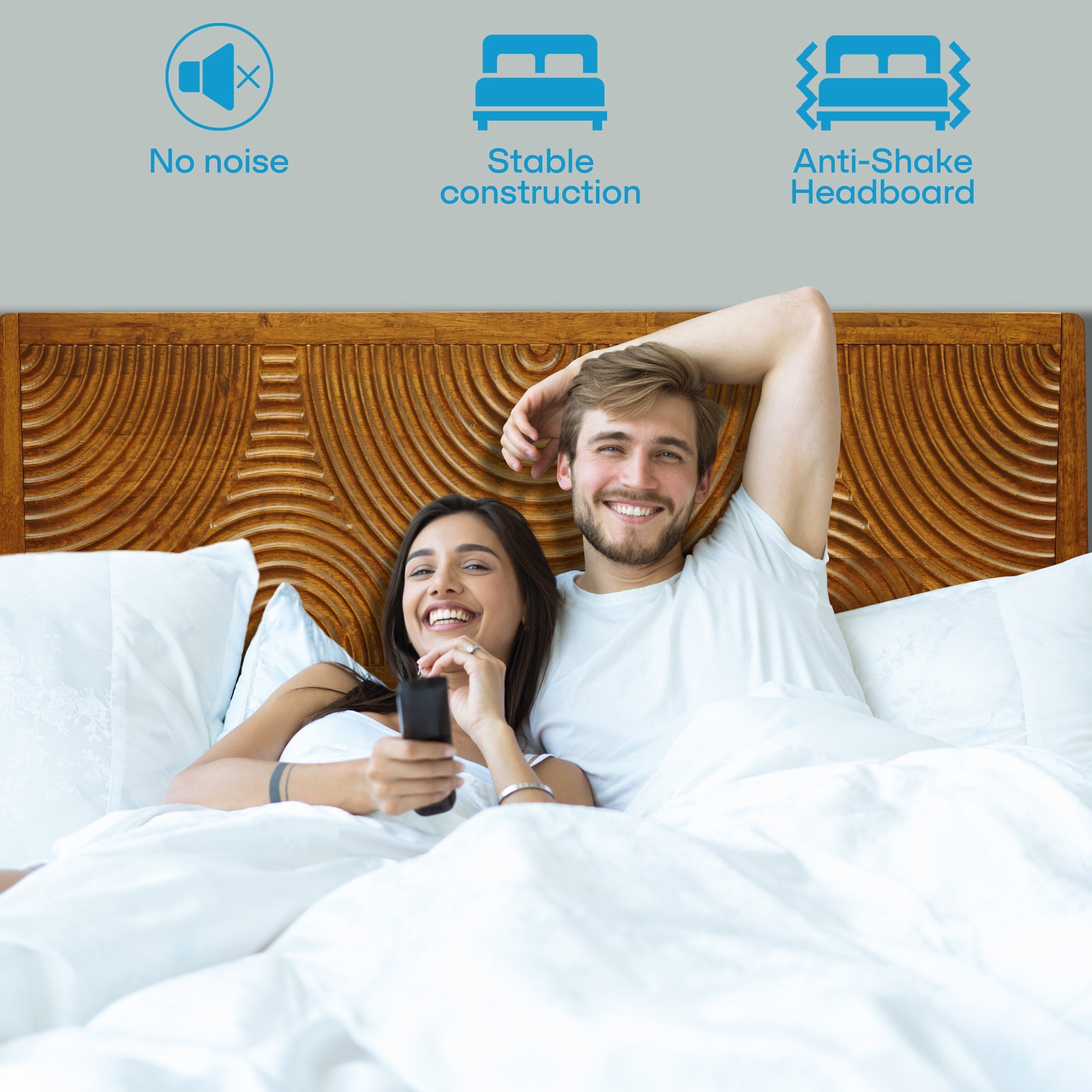 Couple in bed with a wooden headboard, icons indicating 'No noise', 'Stable construction', and 'Anti-Shake Headboard'.