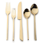 Set of gold-plated cutlery including a fork, knife, and two spoons on a white background.