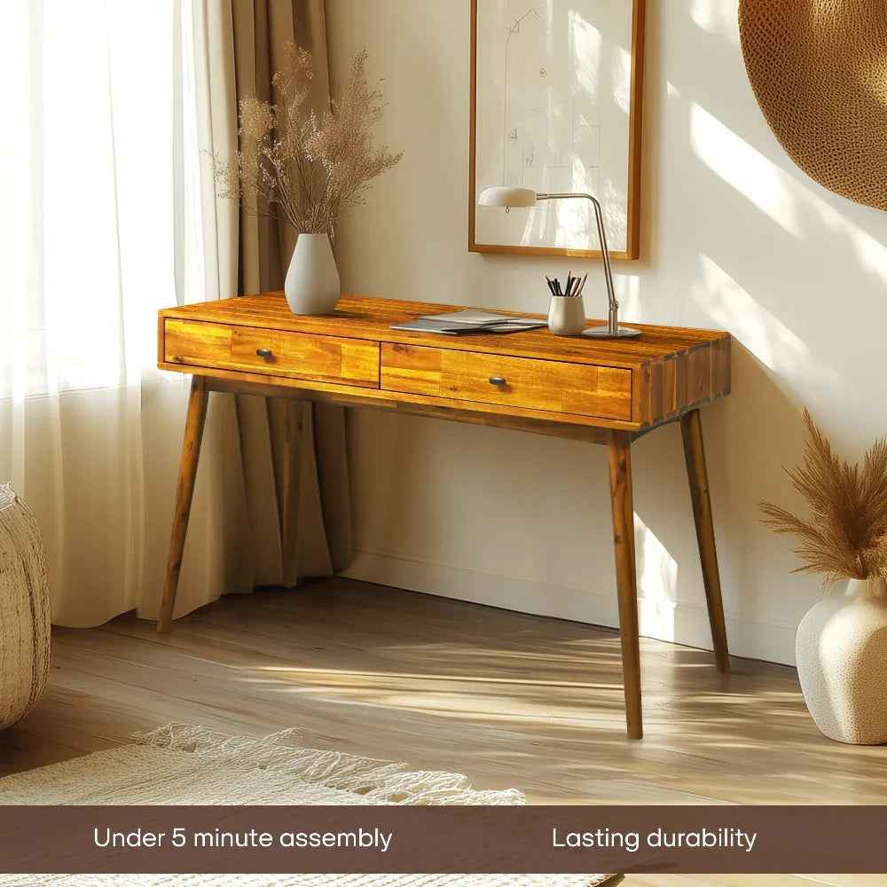 Wooden desk in a room with decor elements and text about assembly and durability.
