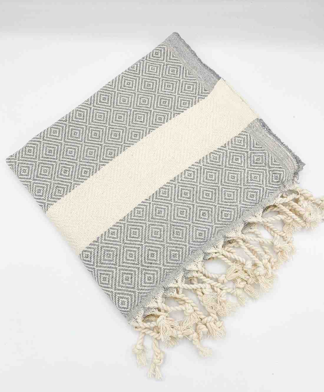 Gray hand towel with diamond pattern and cream stripe, finished with twisted fringe ends