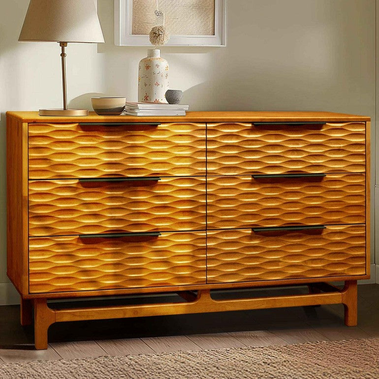 Wooden dresser with wavy pattern in a room setting