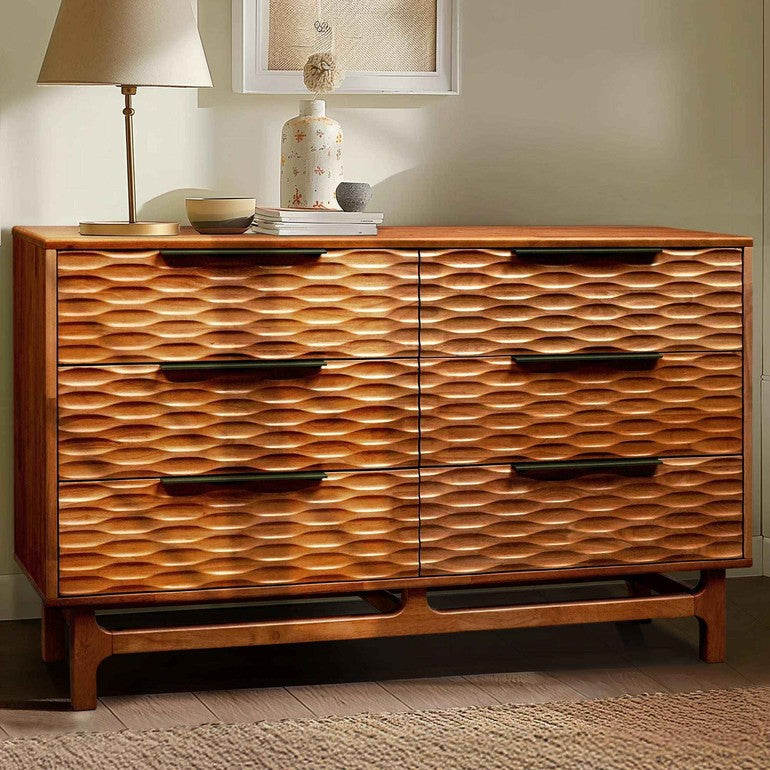 Wooden dresser with wavy pattern in a room setting