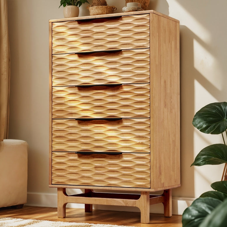 Wooden dresser with wavy pattern and four drawers in a room setting.