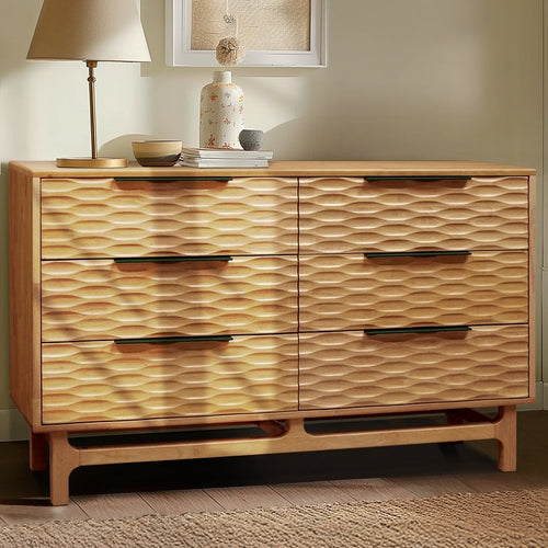 Wooden dresser with wavy pattern in a room setting