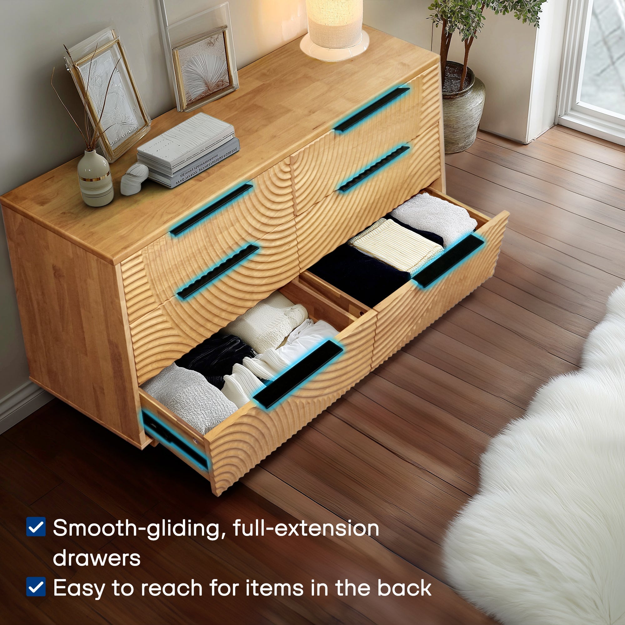 Wooden dresser with open drawers in a room setting