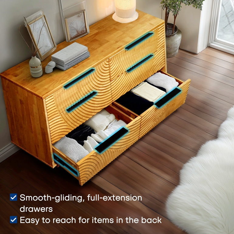 Wooden dresser with open drawers in a room setting