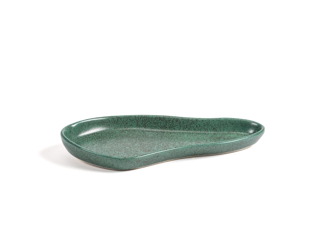 Green ceramic dish on a white background