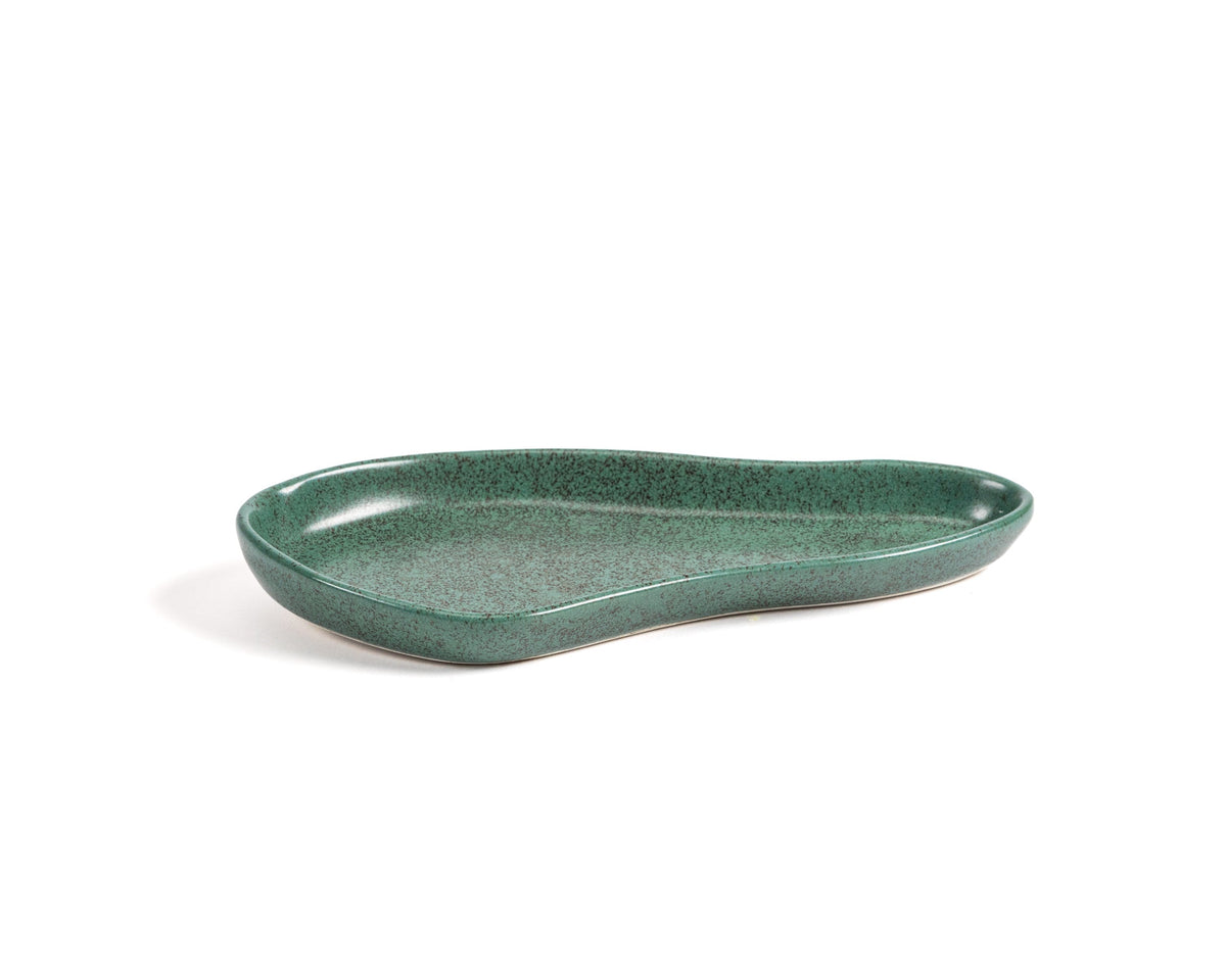 Green ceramic dish on a white background