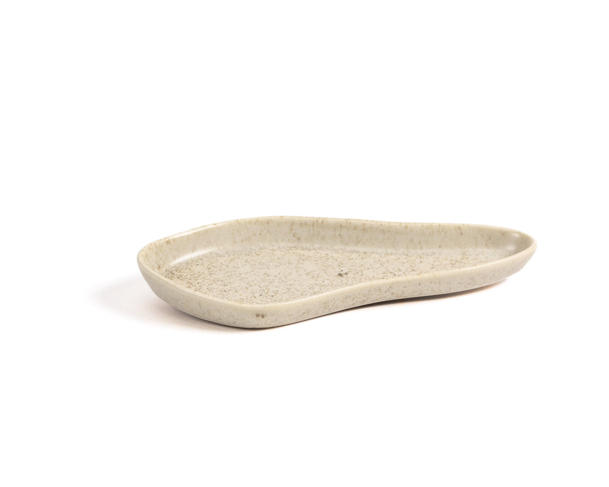 Beige ceramic dish on a white background