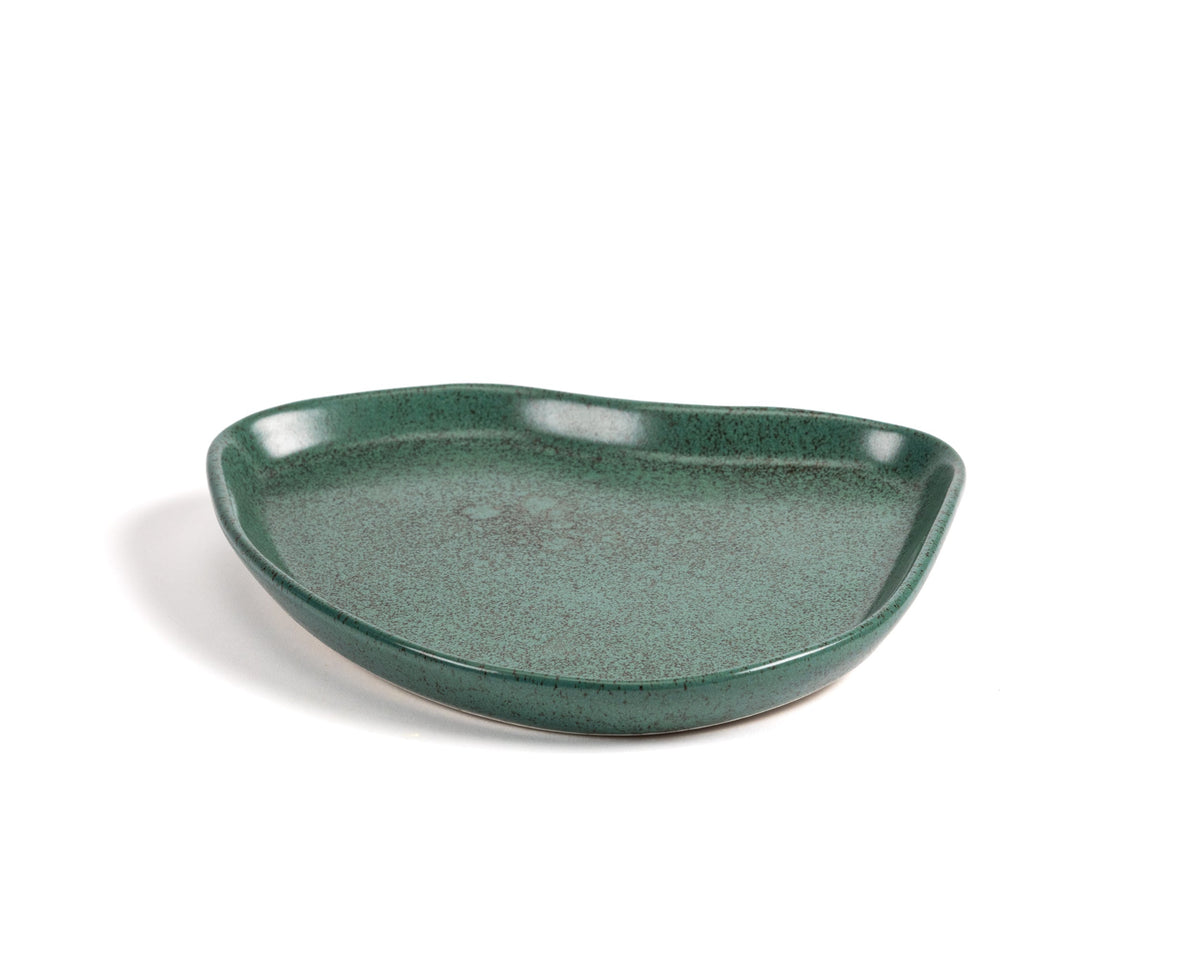 Green ceramic dish on a white background