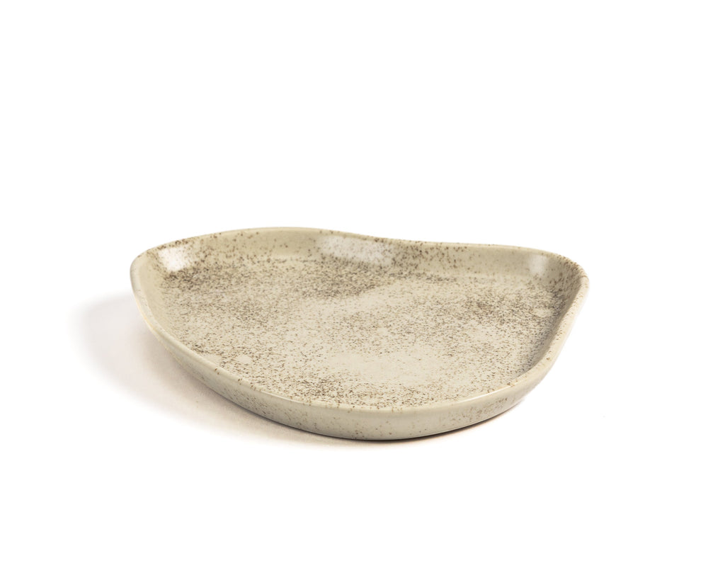 Ceramic dish with textured surface on a white background
