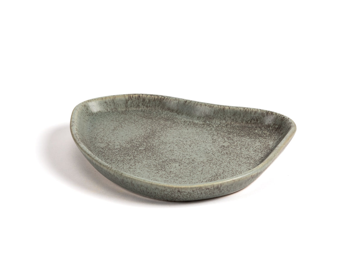 Green ceramic dish on a white background