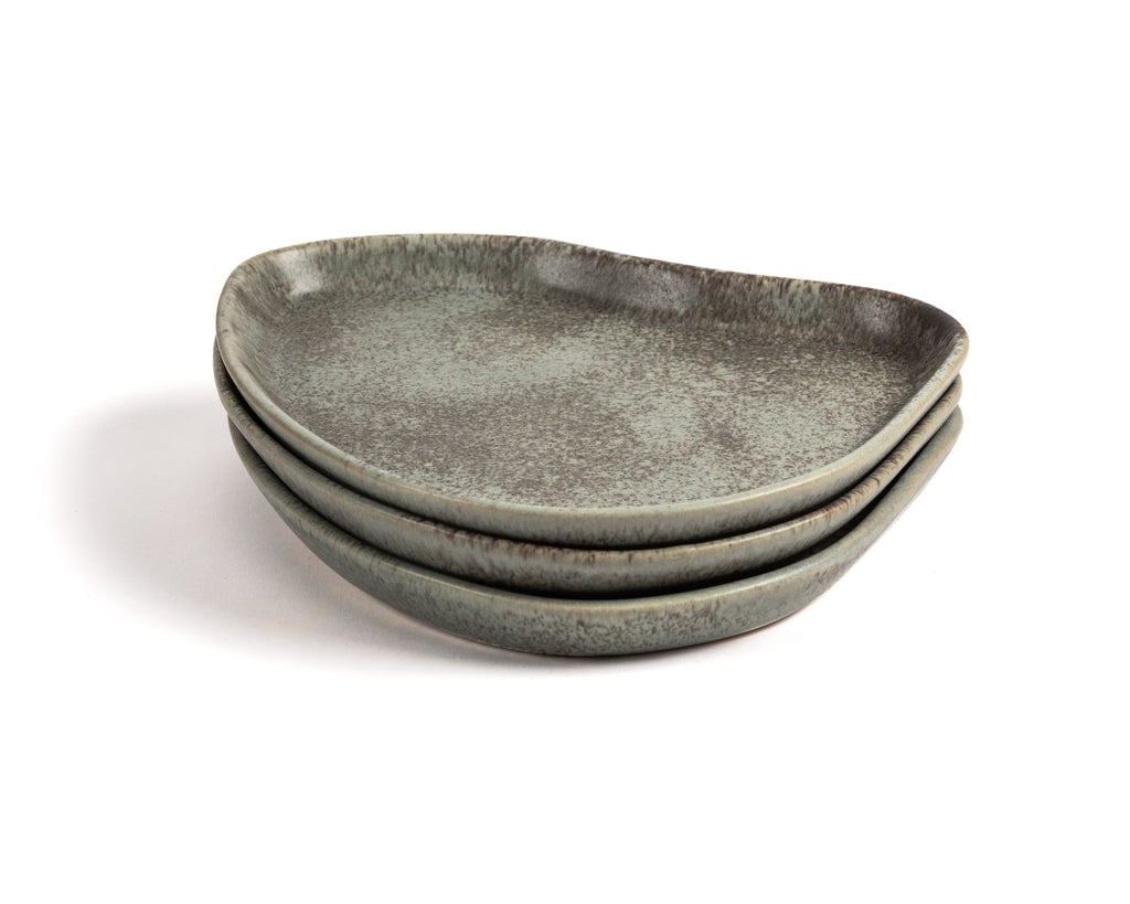 Set of three gray ceramic plates on a white background