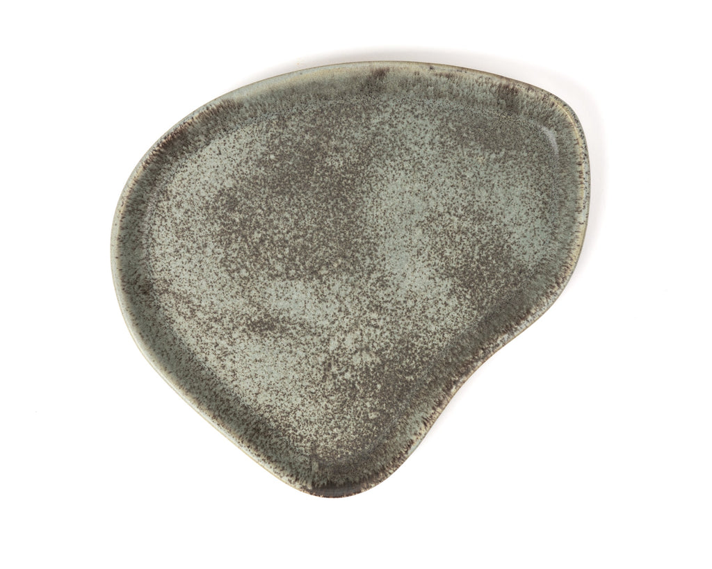 Textured green ceramic plate on a white background