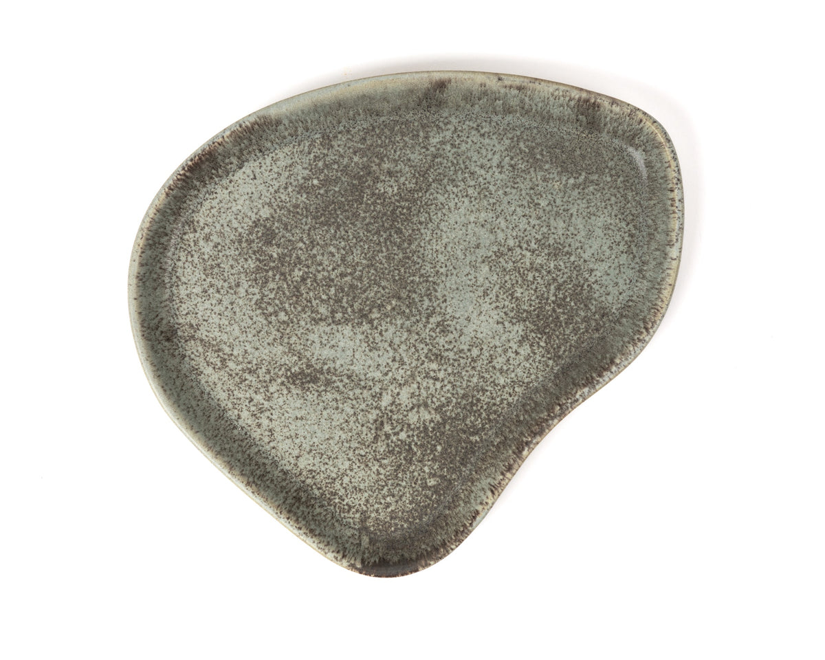Textured green ceramic plate on a white background
