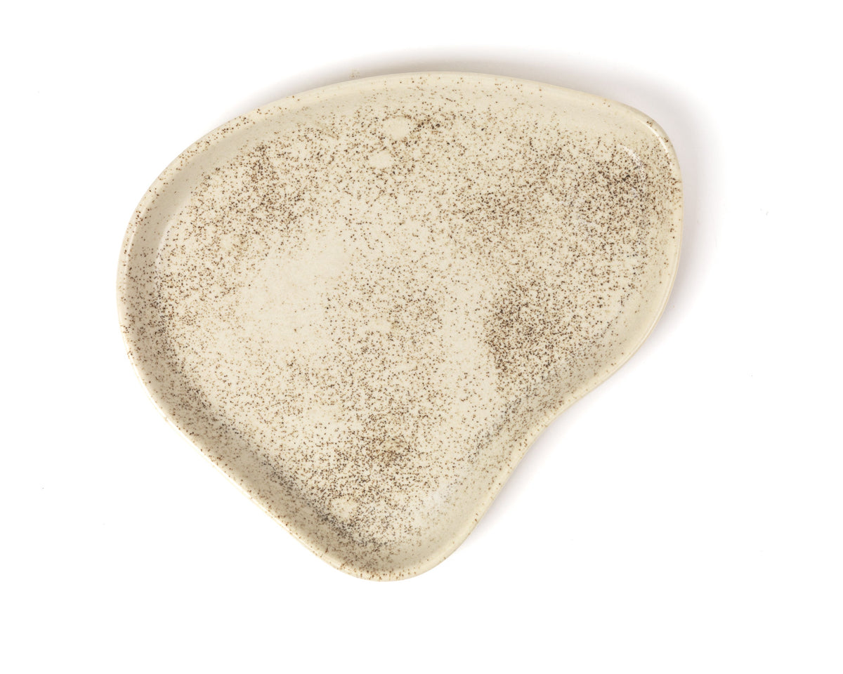 Beige plate on a white background