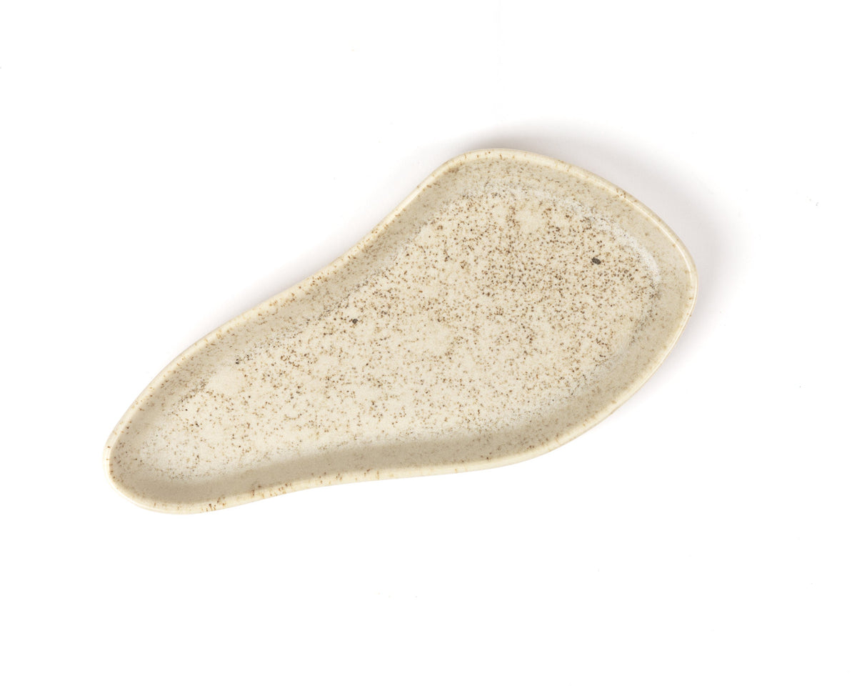 Beige ceramic dish on a white background