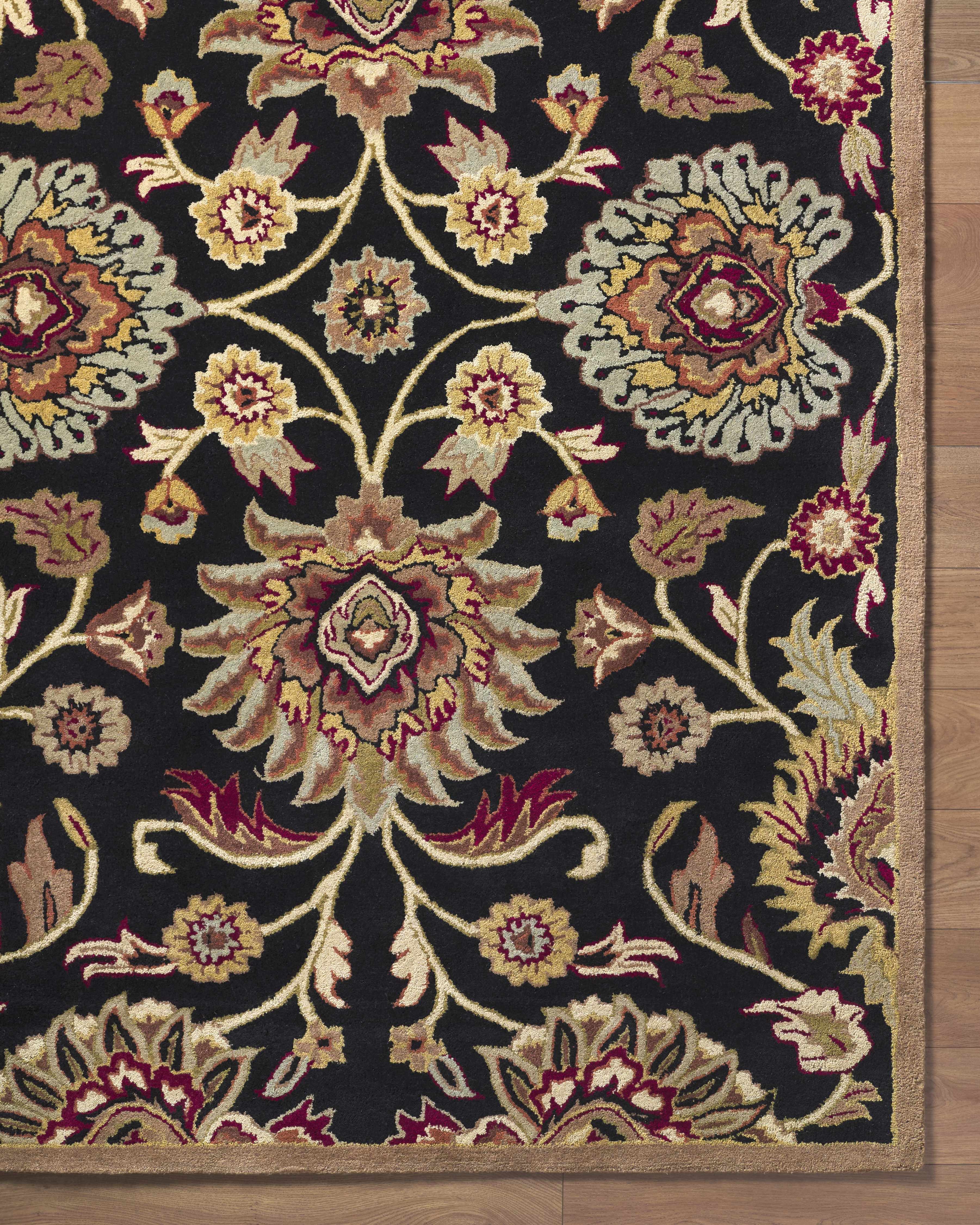 Decorative floral rug with intricate patterns on a dark background