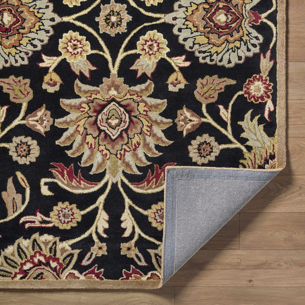 Decorative rug with intricate patterns on a wooden floor
