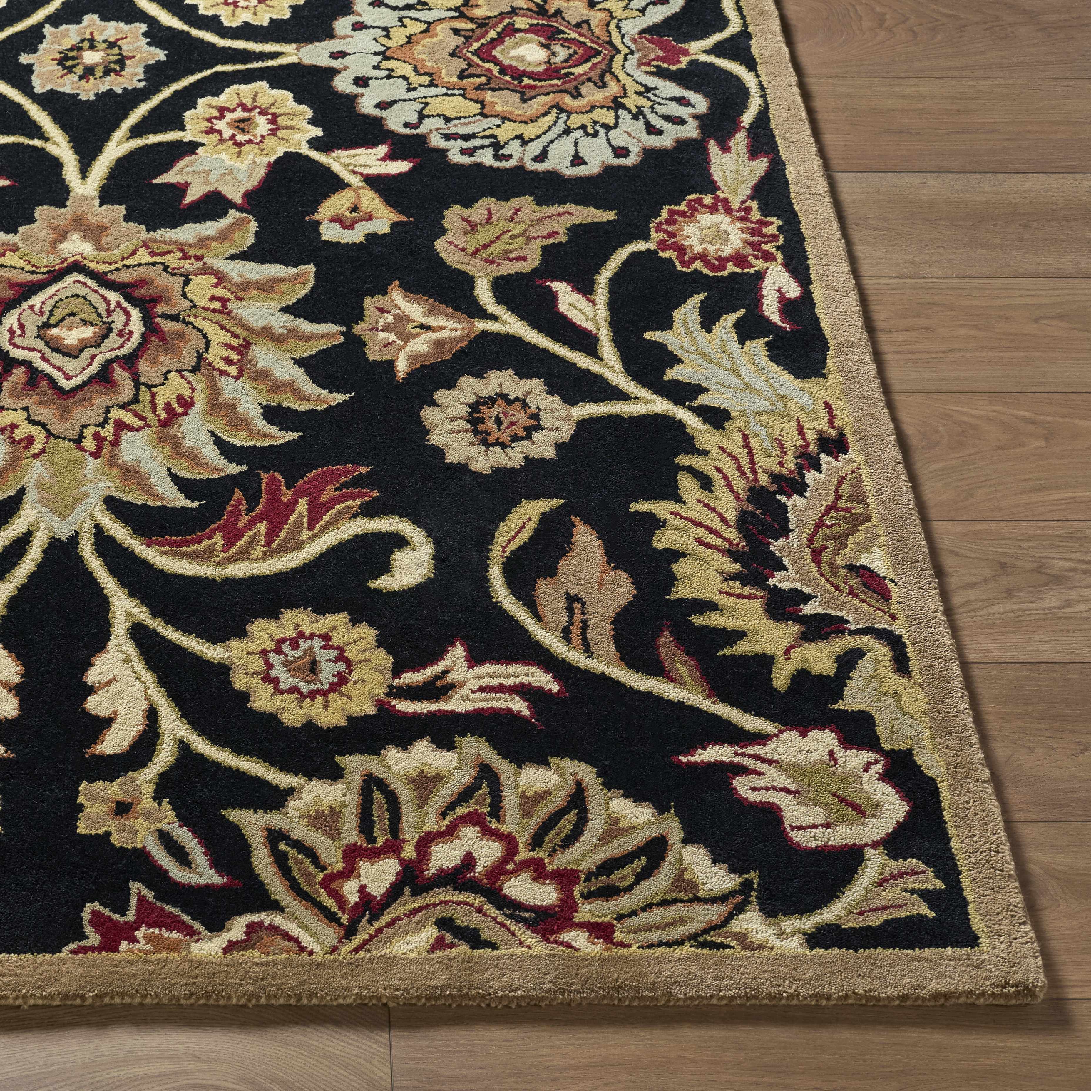 Decorative floral rug on a wooden floor