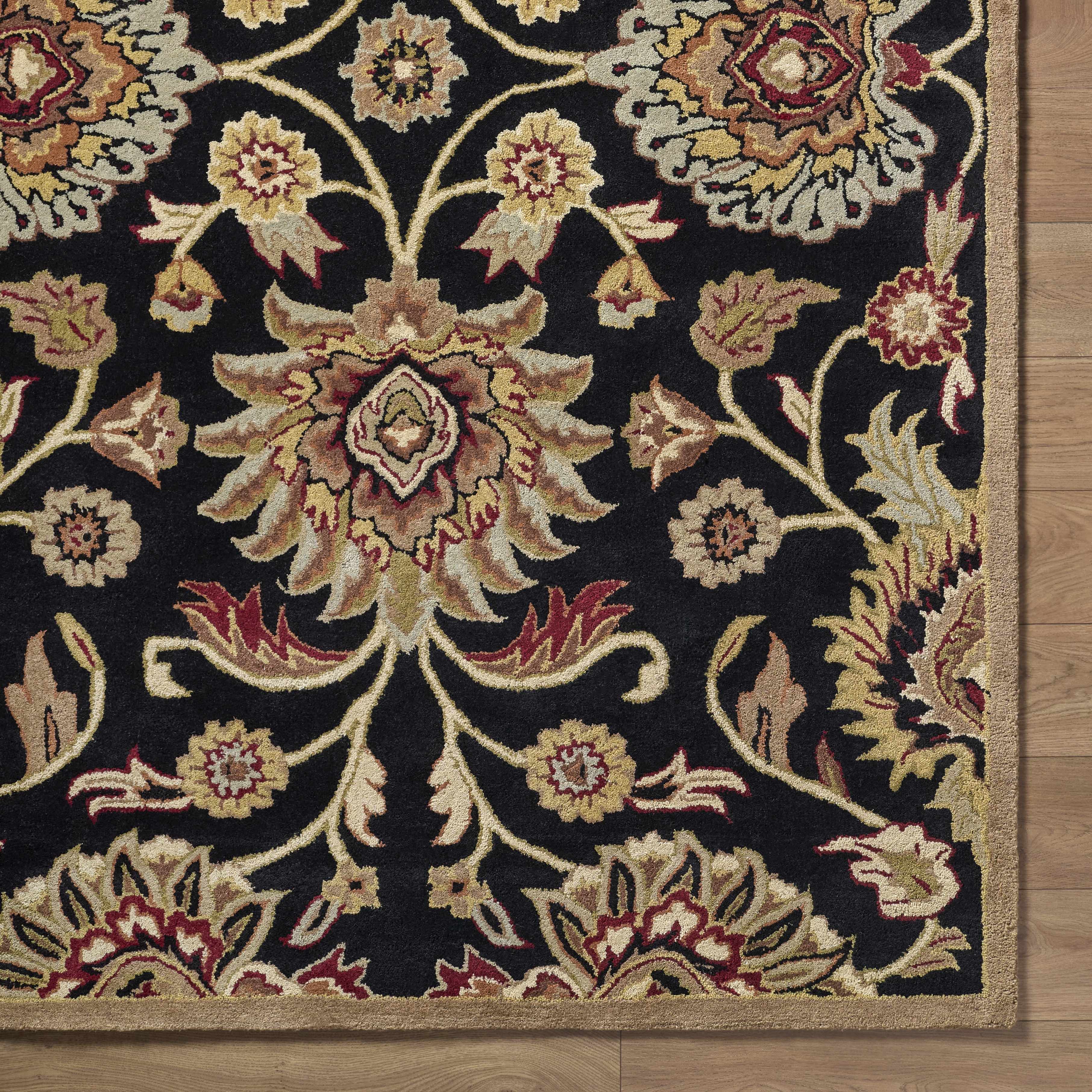 Decorative floral-patterned rug on a wooden floor