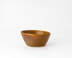 Brown ceramic bowl on a white background