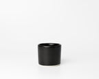Black ceramic cup on a white background
