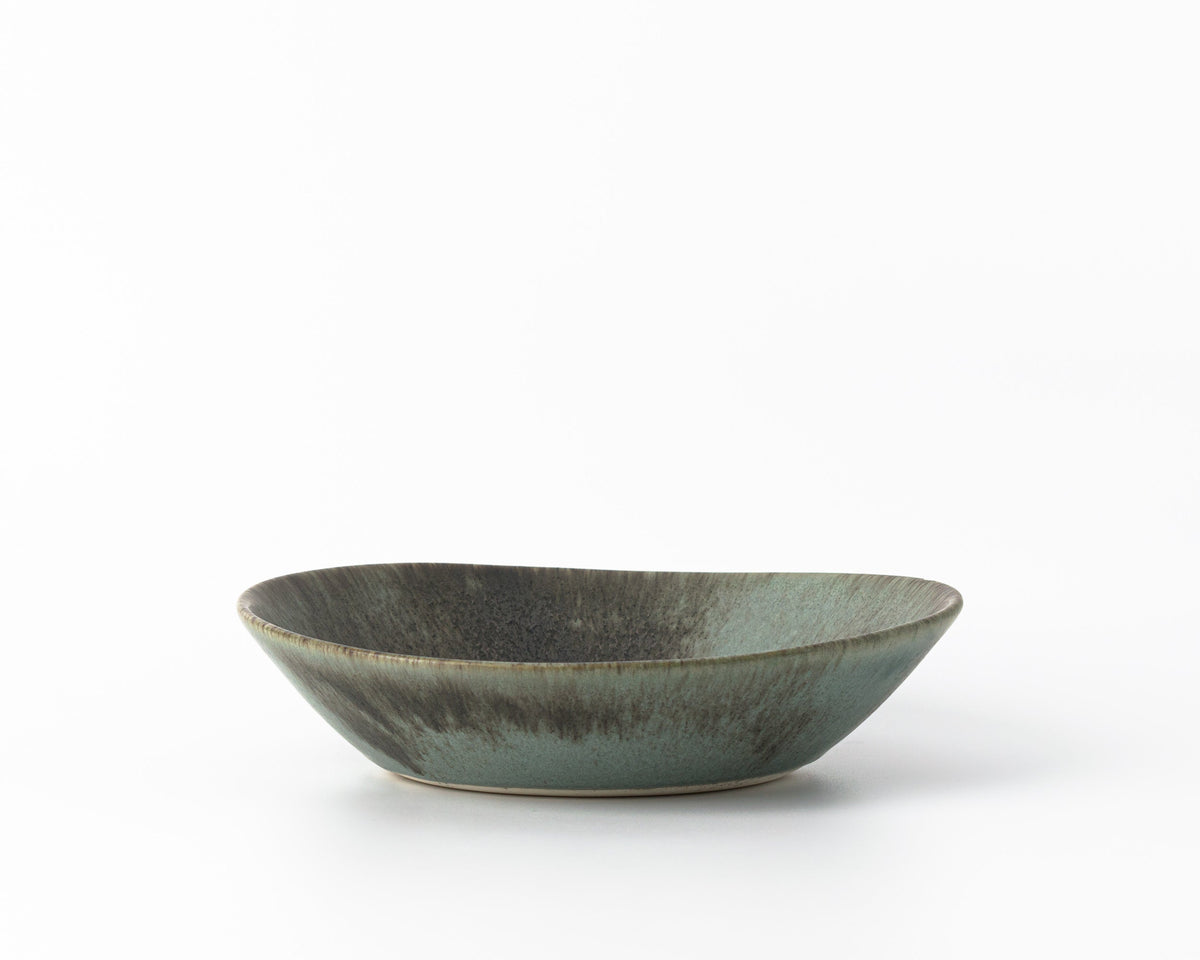 Ceramic bowl with a textured surface on a white background