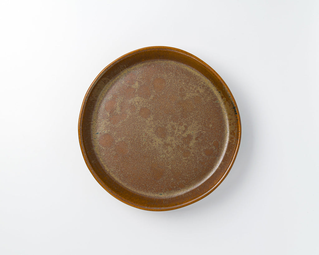 Brown ceramic plate on a white background