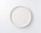 White ceramic plate on a light gray background