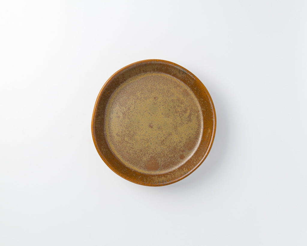 Brown ceramic plate on a white background