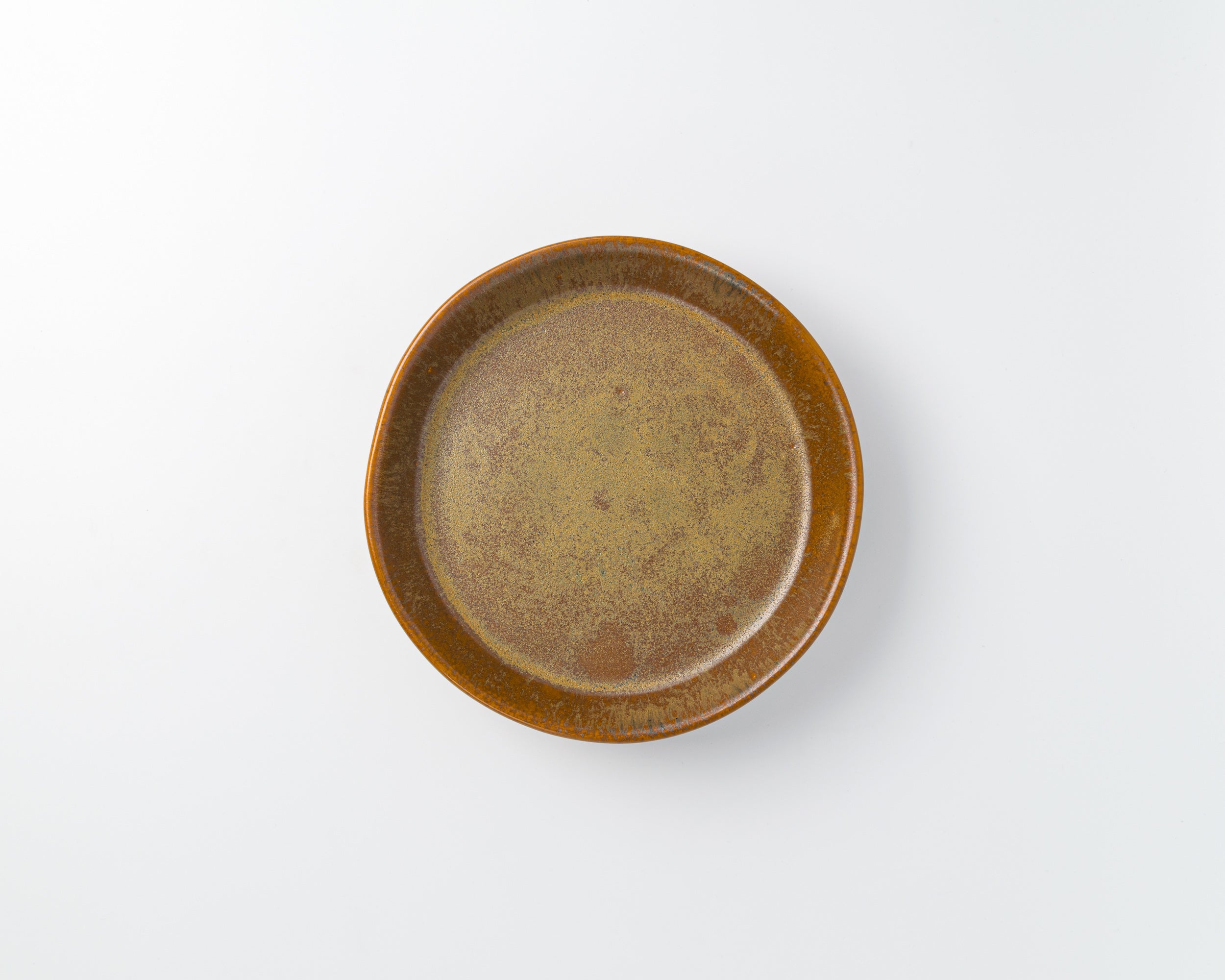 Brown ceramic plate on a white background
