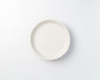 White ceramic plate on a light gray background