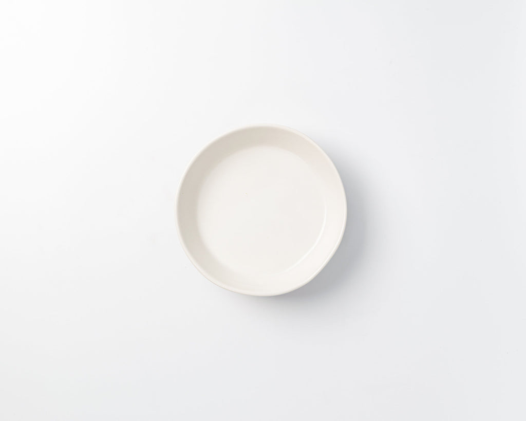 White ceramic plate on a light gray background