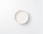 White ceramic plate on a light gray background