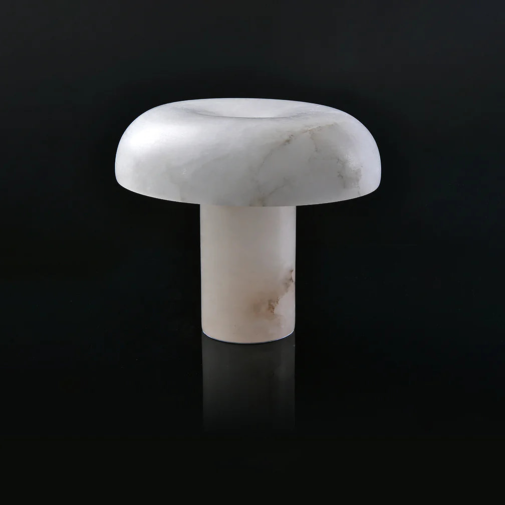 Marble mushroom-shaped object on a black background