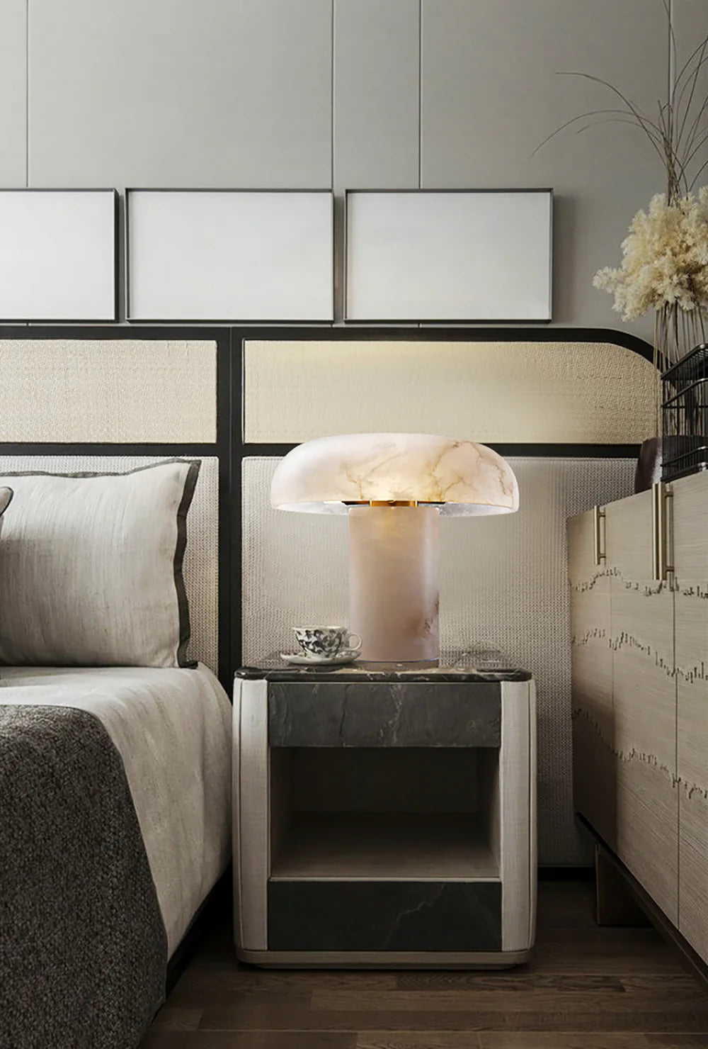 Modern bedroom with a bed, nightstand, and decorative elements.