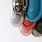 Set of colorful pet bowls on a white background