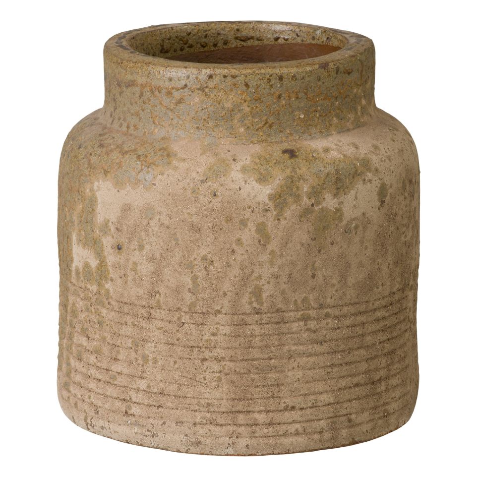 Textured ceramic jar on a white background